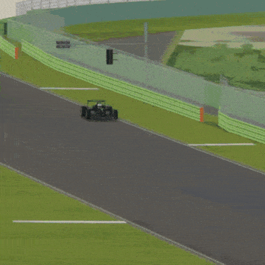 a petronas race car is driving down a track