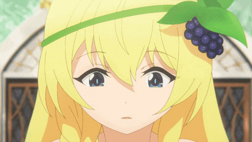 a girl with blonde hair and a green headband with a bunch of grapes on it