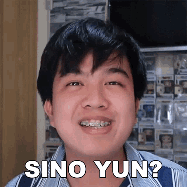 a man with braces on his teeth is smiling and says sino yun