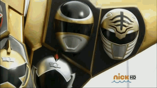 three power ranger helmets are displayed on a nickelodeon advertisement