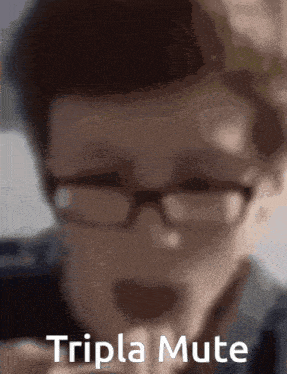 a close up of a person wearing glasses with triple mute written in white