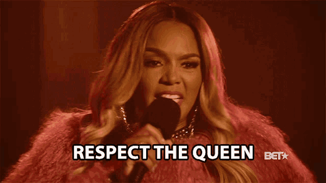 a woman in a pink fur coat singing into a microphone with the words respect the queen below her