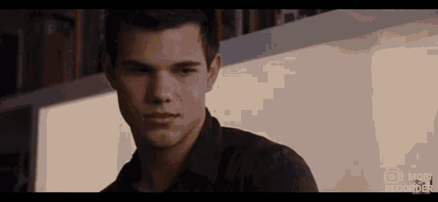 a close up of a man 's face in a movie .