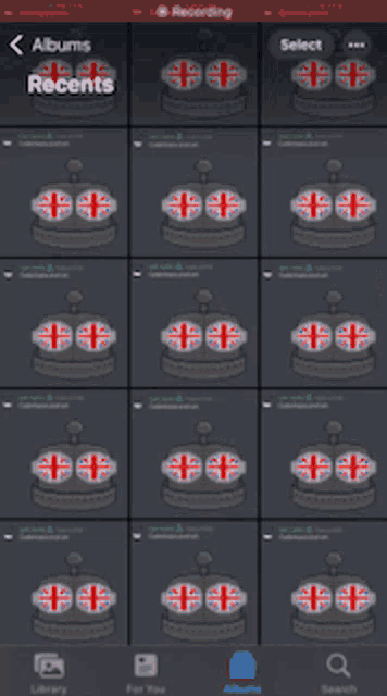 a phone screen shows a list of recent albums with british flags on them