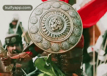 a close up of a shield with a lion head on it