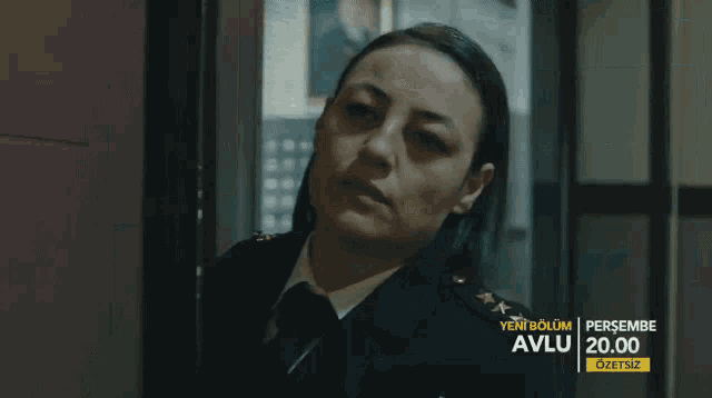 a woman in a military uniform with the words yeni bolum avlu 20.00