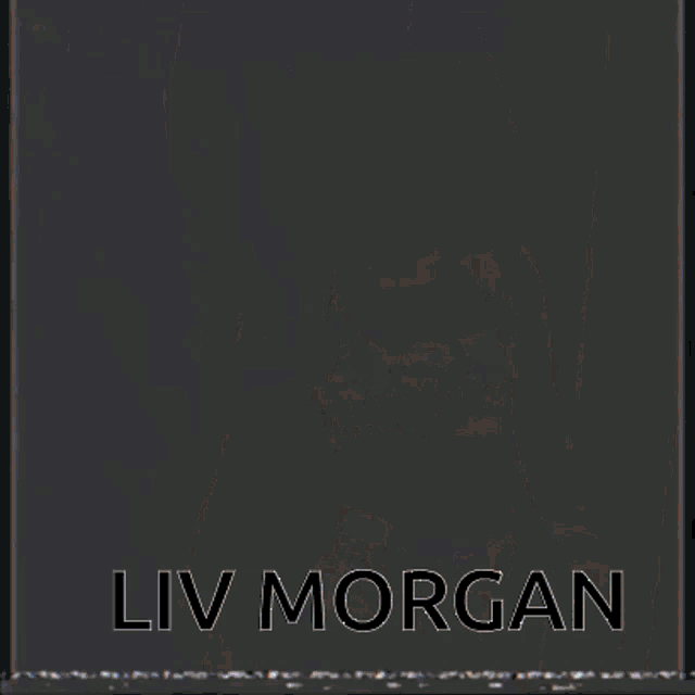 a woman in a wrestling ring with the name liv morgan