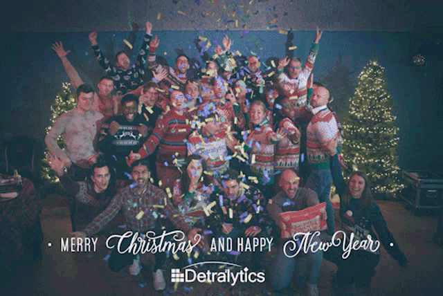 a group of people are posing for a picture with the words merry christmas and happy new year below them