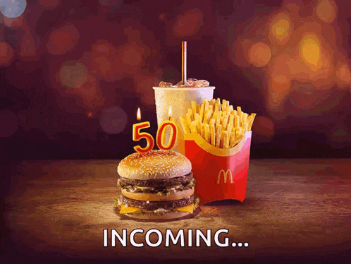 a mcdonald 's advertisement shows a hamburger french fries and a drink and says incoming