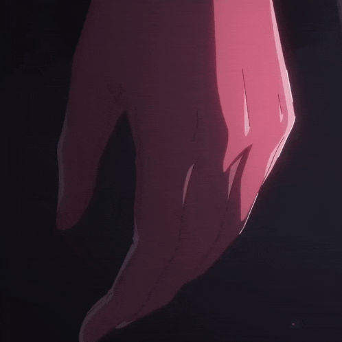 a close up of a person 's hand against a dark background