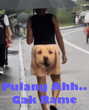a man wearing shorts that look like a dog walking down a street