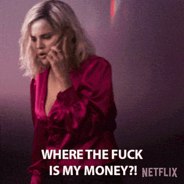 a woman in a pink shirt is talking on a phone and says where the fuck is my money