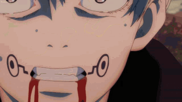 a close up of a person 's face with blood coming out of his mouth
