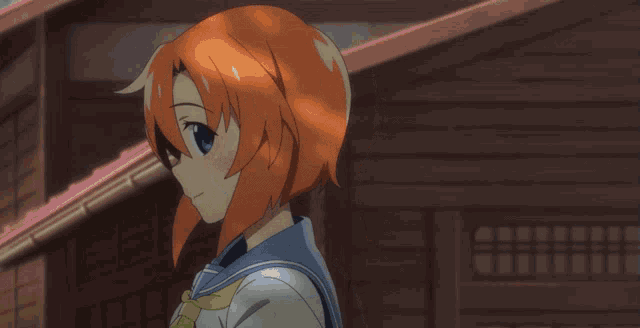a girl with red hair is wearing a sailor outfit