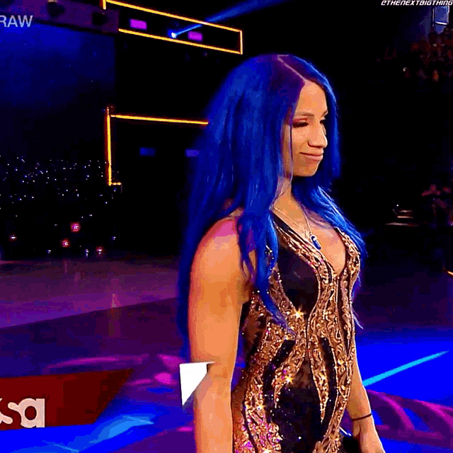 a woman with blue hair is standing in front of a raw sign