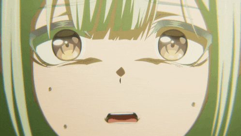 a close up of a girl 's face with a surprised expression
