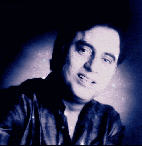a close up of a man 's face with sparkles around him