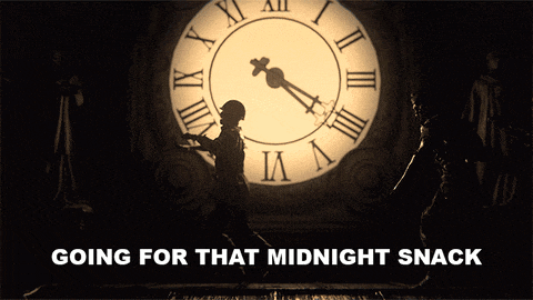 a clock with roman numerals and the words " going for that midnight snack " below it
