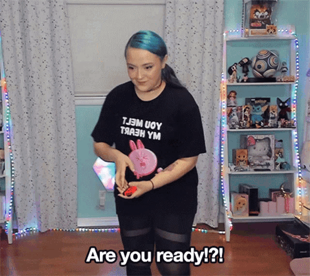 a woman wearing a black t-shirt that says tjem uoy thah ym