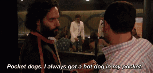a man is talking to another man and says pocket dogs i always got a hot dog in my pocket .