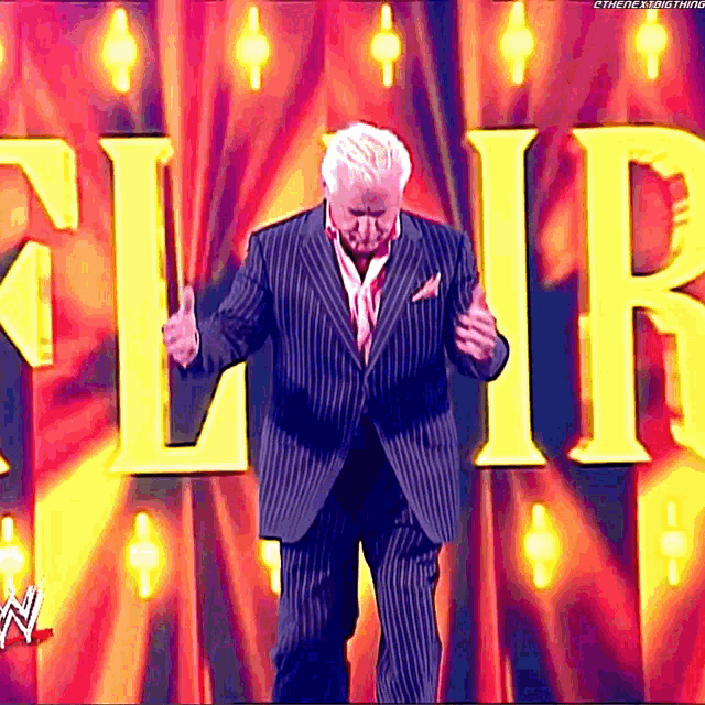 a man in a suit is standing in front of a sign that says cirque
