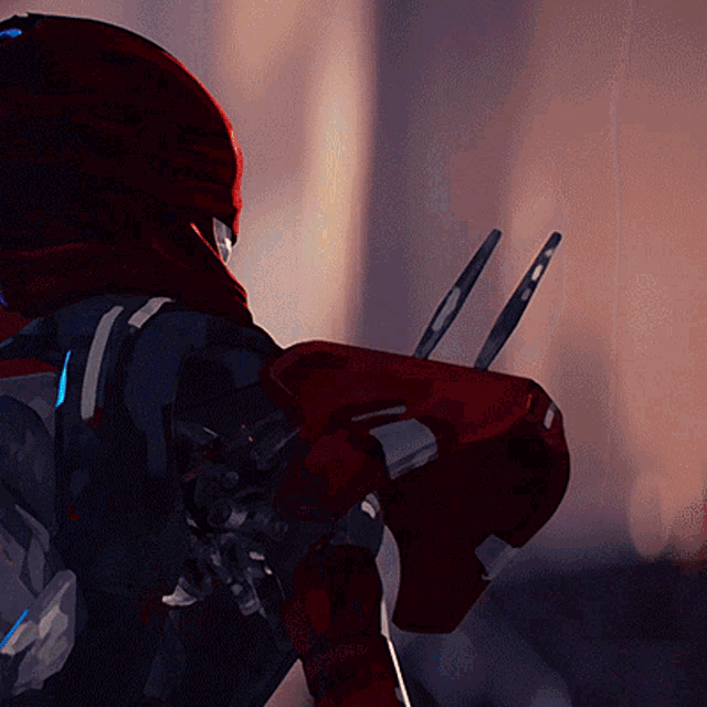 a close up of a robot 's arm with a red helmet on
