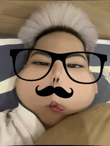 a man with glasses and a mustache on his face