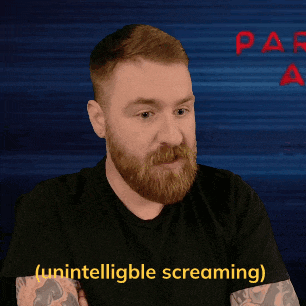 a man with a beard and a black shirt is screaming