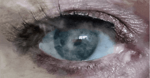 a close up of a woman 's blue eye