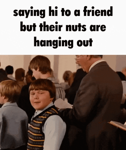 a man in a suit is standing next to a boy in a crowd and says " saying hi to a friend "