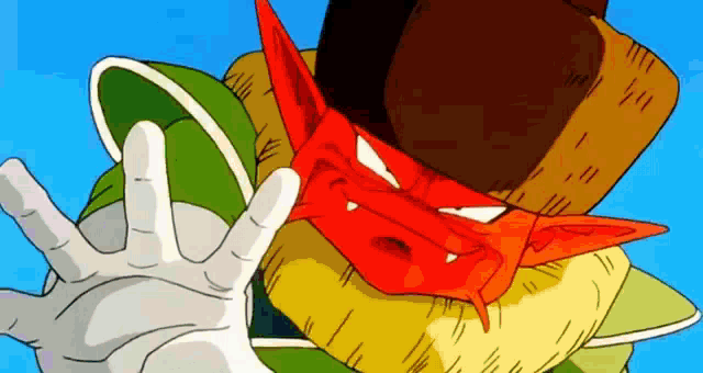 a cartoon character with a red face and a hat is making a hand gesture .