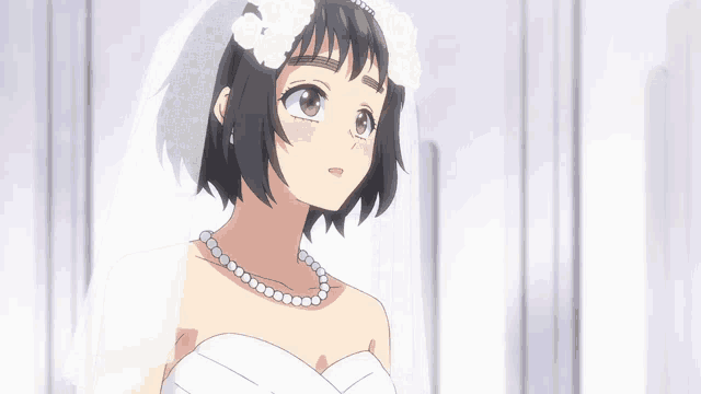 a girl in a white dress and veil looks up