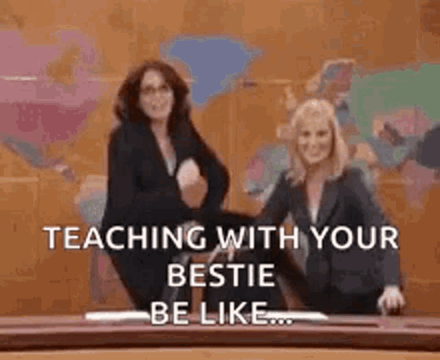two women are standing next to each other in front of a map of the world .