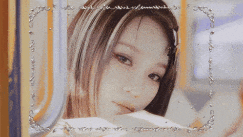 a close up of a woman 's face in a frame that says ' anniversary '