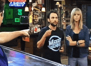 a man wearing a t-shirt that says ' magn ' on it