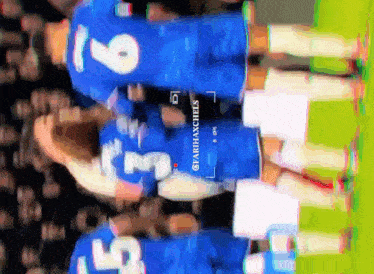 a blurry picture of a soccer player with the number 6 on the back of his jersey