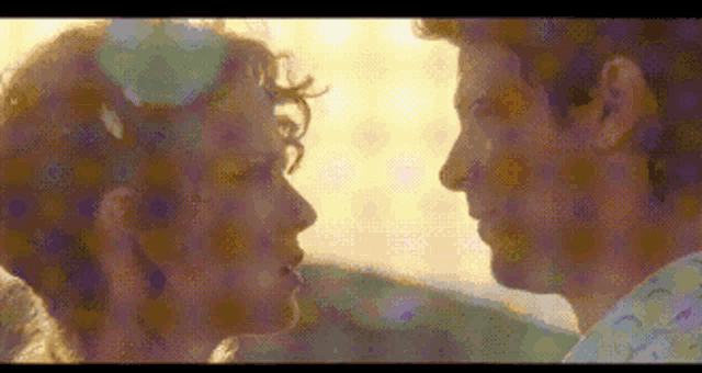 a man and a woman are looking at each other in a pixel art .