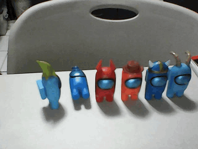 among us toys are lined up in a row