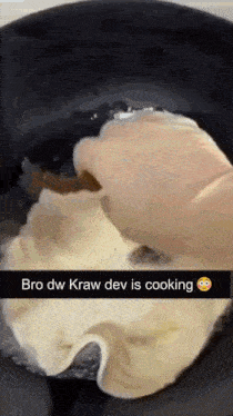 a person is cooking in a pot with a smiley face on the bottom