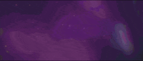 a person is holding a sparkler in front of a purple sky