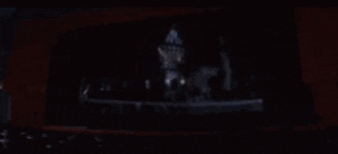 a close up of a woman 's face in the dark