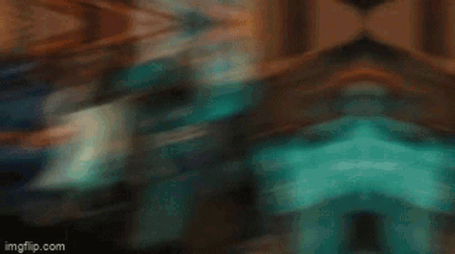 a blurry picture of a person 's face with a green and white background .