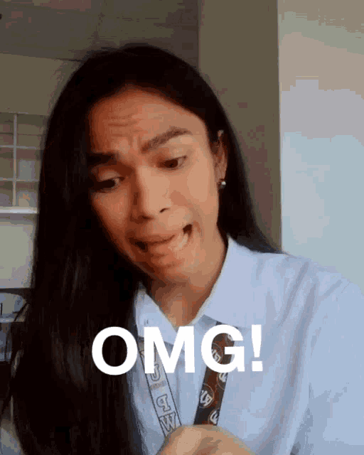 a woman making a funny face with the words omg written on her face