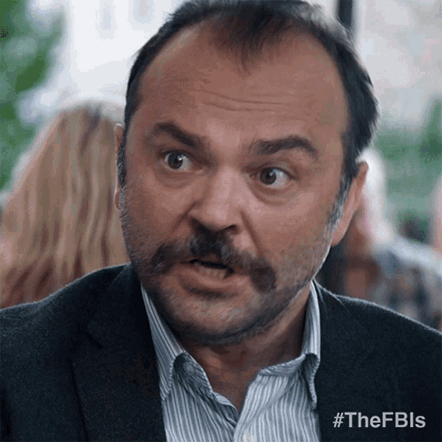 a man with a mustache is making a funny face with #thefbls on the bottom