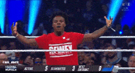 a man in a red shirt that says county on it is in a boxing ring