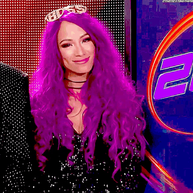 a woman with purple hair wearing a tiara with the word boss on it