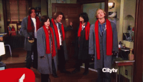 a group of people standing in front of a door with the word citytv on the bottom