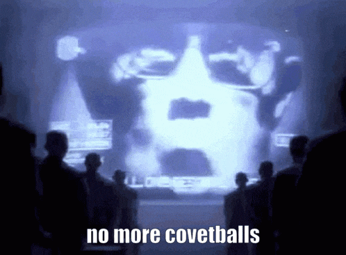 a group of people are looking at a screen that says no more covetballs
