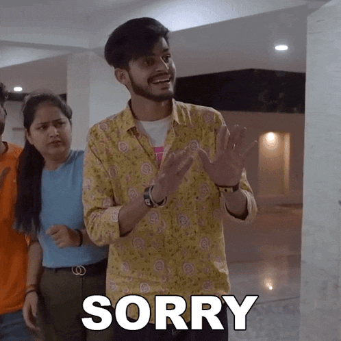 a man in a yellow shirt says sorry