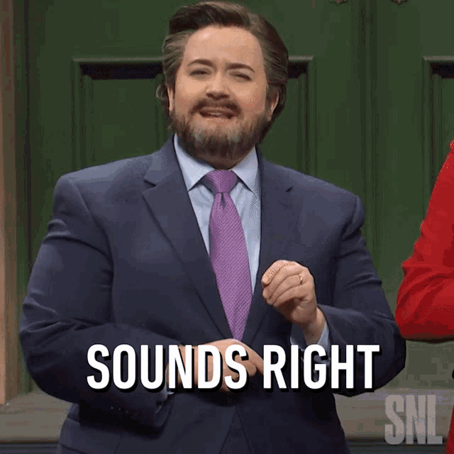 a man in a suit and tie says " sounds right " in front of a green door